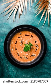 Mashed Lentil Soup, Red Lentil Soup Puree In Black Plate On Table With Copy Space.