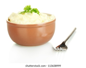 Mashed potato with parsley in the bowl isolated on white