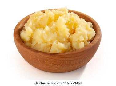 Mashed potatoes in the wooden bowl on the white