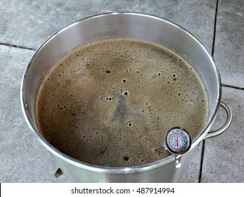 Mashing Malted Grain To Make Beer