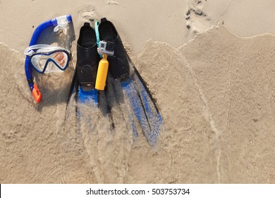 Mask And Flippers On Sand