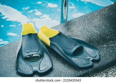 Mask and flippers in a swimming pool. Swim items (Masks and fins)
Sports accessories for swimming. Underwater masks and flippers - Powered by Shutterstock