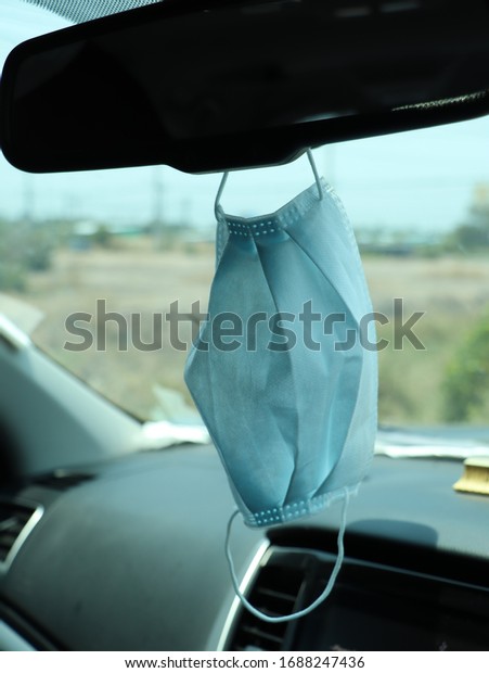 mask hanging in the car, ready to\
use. The nose mask should be carried or carried at all\
times