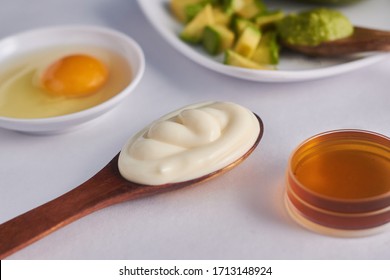 Mask Of Mayonnaise Avocado Egg In A Spoon And Honey