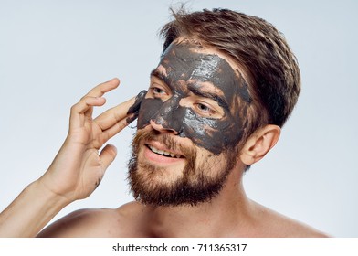 Mask On The Face Of A Man Of Clay On A Light Background Portrait, Beauty, A Problem With The Skin                               