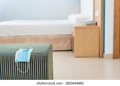 Mask Resting On A Striped Stool In A Hotel Room In Majorca, Background Out Of Focus. New Habits In Responsible Tourism 