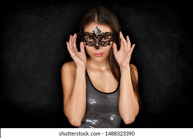 Mask Woman Wearing Black Hiding Eye Costume For Masquerade Ball At Rio De Janeiro. Seduction And Mysterious Girl. Asian Beauty Wearing Carnival On Black Background. Blackboard Texture.