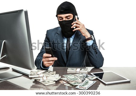 Masked anonymous businessman wearing balaclava helmet