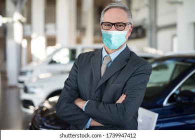 Masked Car Dealer Principal Inside Showroom During Coronavirus Pandemic