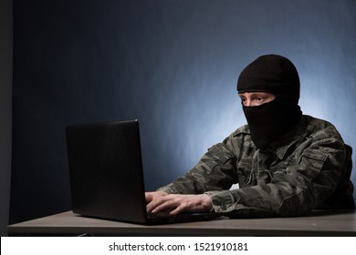 Masked Cyber Terrorist In Military Uniform Hacking Army Intelligence