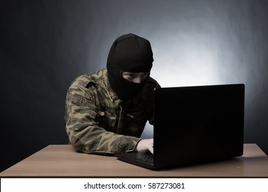 Masked Cyber Terrorist In Military Uniform Hacking Army Intelligence