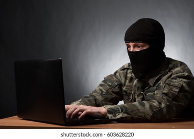 Masked Cyber Terrorist In Military Uniform Hacking Army Intelligence