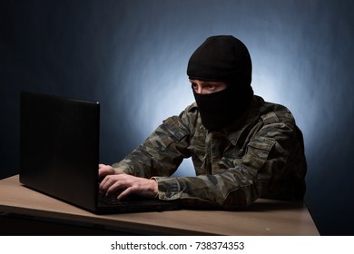 Masked Cyber Terrorist In Military Uniform Hacking Army Intelligence