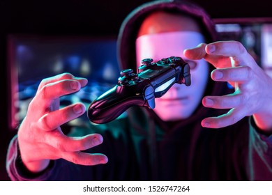 Masked Hacker is Using Computer for Organizing Massive Data Breach Attack on Corporate Servers. 