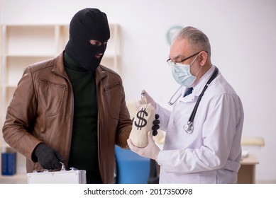 Masked Man Burglar Bribing Old Doctor For Getting Vaccine