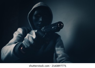 Masked Man Holding A Gun