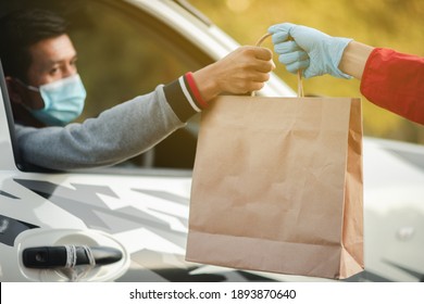 Masked Man, Restaurant Customer, In Car To Pick Up Food On Christmas Day Online Food Delivery Concept