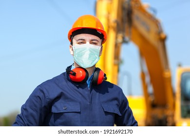 Masked Man At Work In A Construction Site, Covid Coronavirus Construction Concept