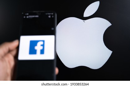 Maski, India 11,March 2021 : Selective Focus On Apple Logo, Facebook Social Media App On Phone And Apple On Background Display, Concept Of Facebook Vs Apple Over Data Privacy