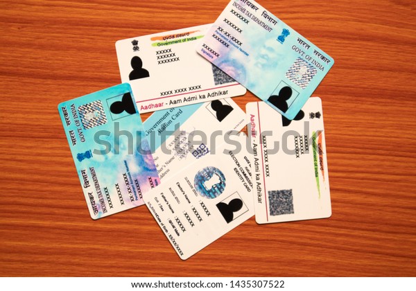 Maski,Karnataka,India - June 26, 2019: Aadhaar card,\
Ration card, Voter ID and Pan card which is issued by Government of\
India as an identity\
card