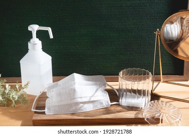 Masks and disinfectant. Image of preventive measures against new coronavirus (COVID-19) and infectious diseases. - Shutterstock ID 1928721788
