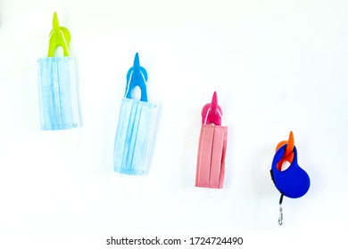 Masks For The Whole Family And Dog Leash Hanging On Individual Hangers