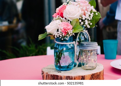 Mason Jar Bouquet Centerpiece With Roses At A Lovely Rustic Wedding