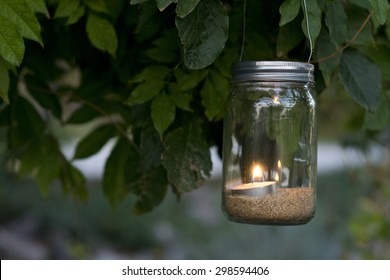 Mason Jar Candle Hanging On Tree For Wedding Decor