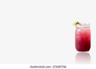 Mason Jar With A Cocktail With Reflection On Glass Surface