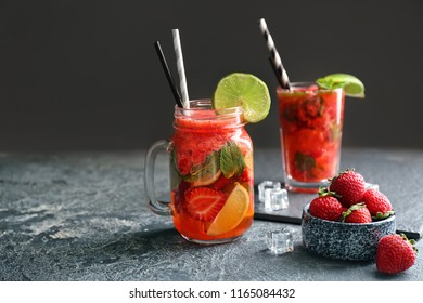 Mason jar of fresh strawberry mojito on grey table - Powered by Shutterstock