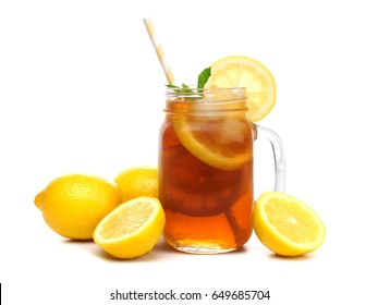 Mason jar glass of iced tea with lemons and straw isolated on a white background