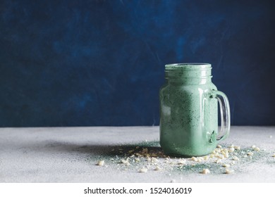 Mason Jar Of Healthy Spirulina Smoothie On Table