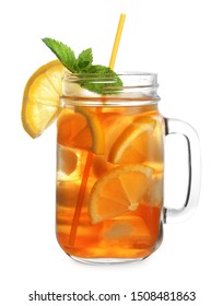 Mason jar of refreshing iced tea with lemon slices and mint on white background
