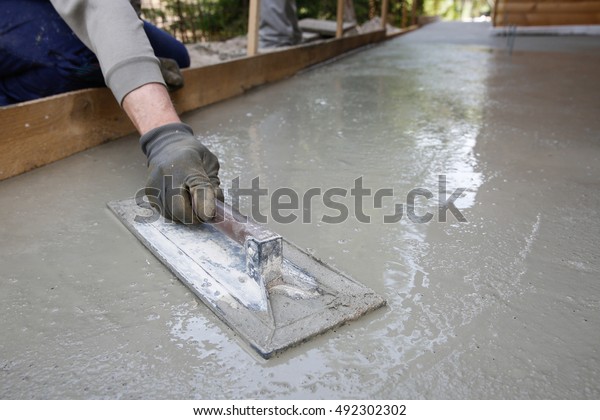 Mason Leveling Screeding Concrete Floor Base Stock Photo