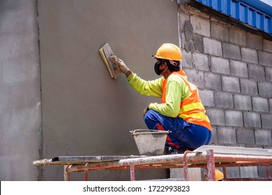 mason rural thailand Plastering concrete to build wall background industrial worker with plastering tools renovating house concept quality