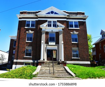 Masonic Lodge Building With Cross On A Sign Saying Knights Templar Meet Here With The Masonic Square And Compasses In Stratford, Ontario, Canada, May 5, 2020. 