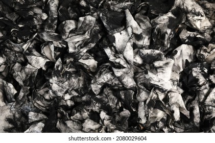 A Mass Of Dirty Used Cloth Wipes Covered In Black Intaglio Printers Ink. Could Be Oil Dipstick Wipes From Mechanic. Unique Abstract Black And White Background Pattern. Art Or Printmaking Education 