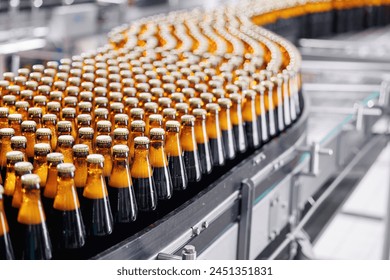 Mass Product of Beer Bottles, Rows of glass production alcohol on industrial conveyor belt.