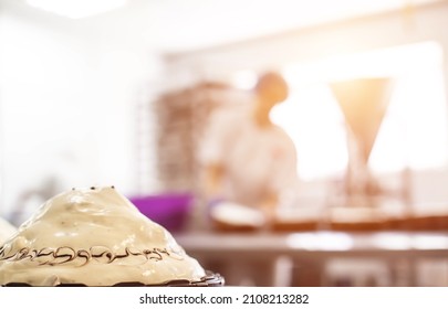 Mass Production Of Cakes And Sweets At The Confectionery Factory. Chefs Make Cakes Of Fresh Berries And Biscuit, Food Industry