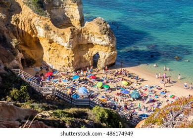 Mass Tourism At Lagos Beach In Algarve Region, Portugal