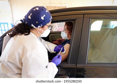 Mass Vaccination Campaign, Inoculation Of Vaccine In The Car At A Drive-through Vaccine Site. Turin, Italy - April 2021