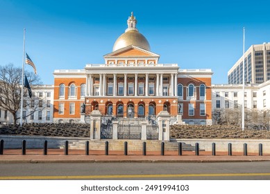 The Massachusetts State House, situated atop Beacon Hill in Boston, is a majestic symbol of the Commonwealth's rich history and governance. Built in 1798, its iconic golden dome is an emblem of Boston - Powered by Shutterstock