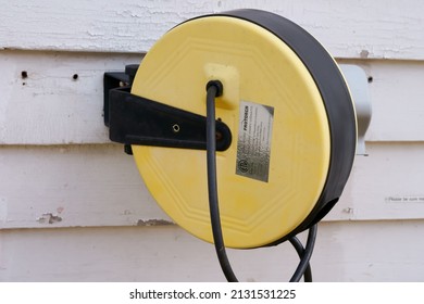 Massachusetts, United States-February 25, 2022: Protorch Retractable Cord Reel Mounted On The Wall