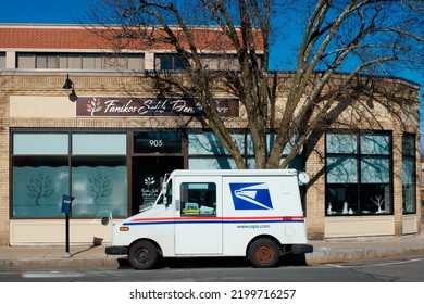 Massachusetts, United States-January 8, 2021: USPS Mail Delivery Car On Street Needham