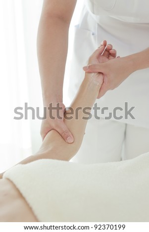 Similar – Hands massaging female abdomen.