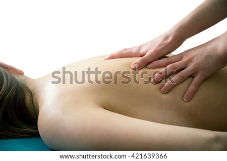 Massage of the back on a white background