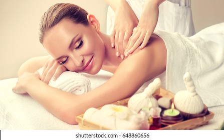 Massage and body  care. Spa body massage   woman hands treatment. Woman having massage in the spa salon for beautiful girl
 - Shutterstock ID 648860656