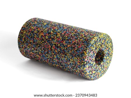 A massage foam roller isolated on a white background. Close-up. Foam rolling is a self myofascial release technique. Concept of fitness equipment.