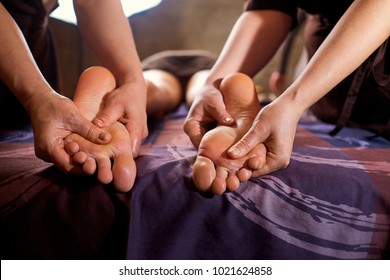 Massage in four hands on feet in the spa salon.  - Shutterstock ID 1021624858