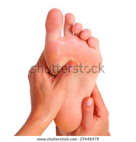 Massage and leaving of the female feet bared by a foot, isolated on a white background, please see some of my other parts of a body images: